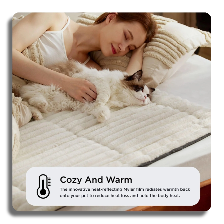 Emotional lifestyle image of a woman sleeping next to her cat on a white thermal mat, emphasizing 'Cozy and Warm' comfort.