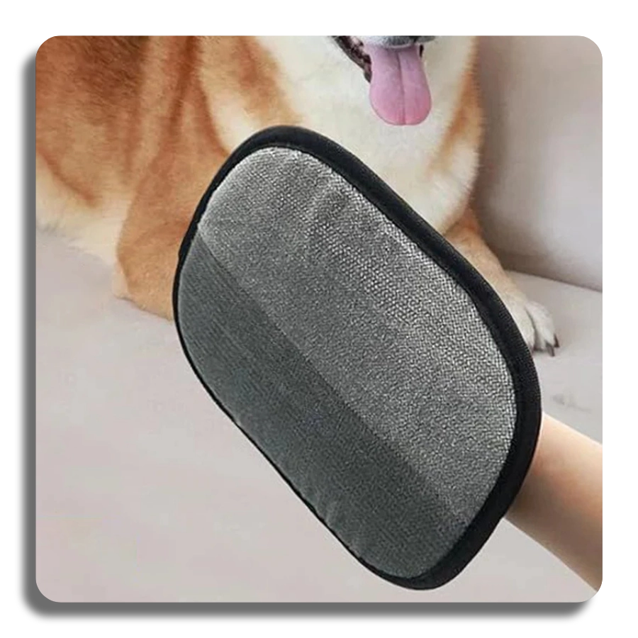 Grey side of the pet grooming glove being used to gently massage and remove fur from a happy dog.