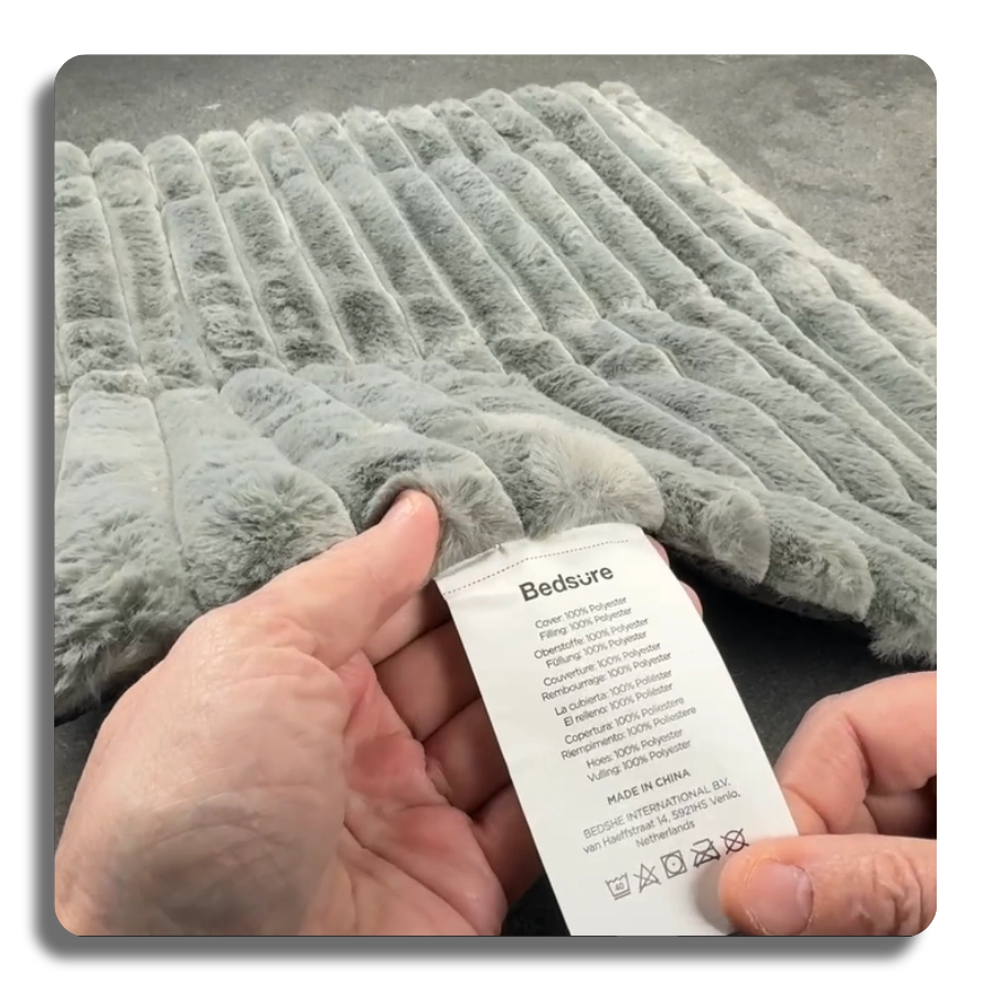 Close-up of the grey self-warming pet mat fabric and Bedsure brand label, showing 100% polyester material and professional manufacturing details.