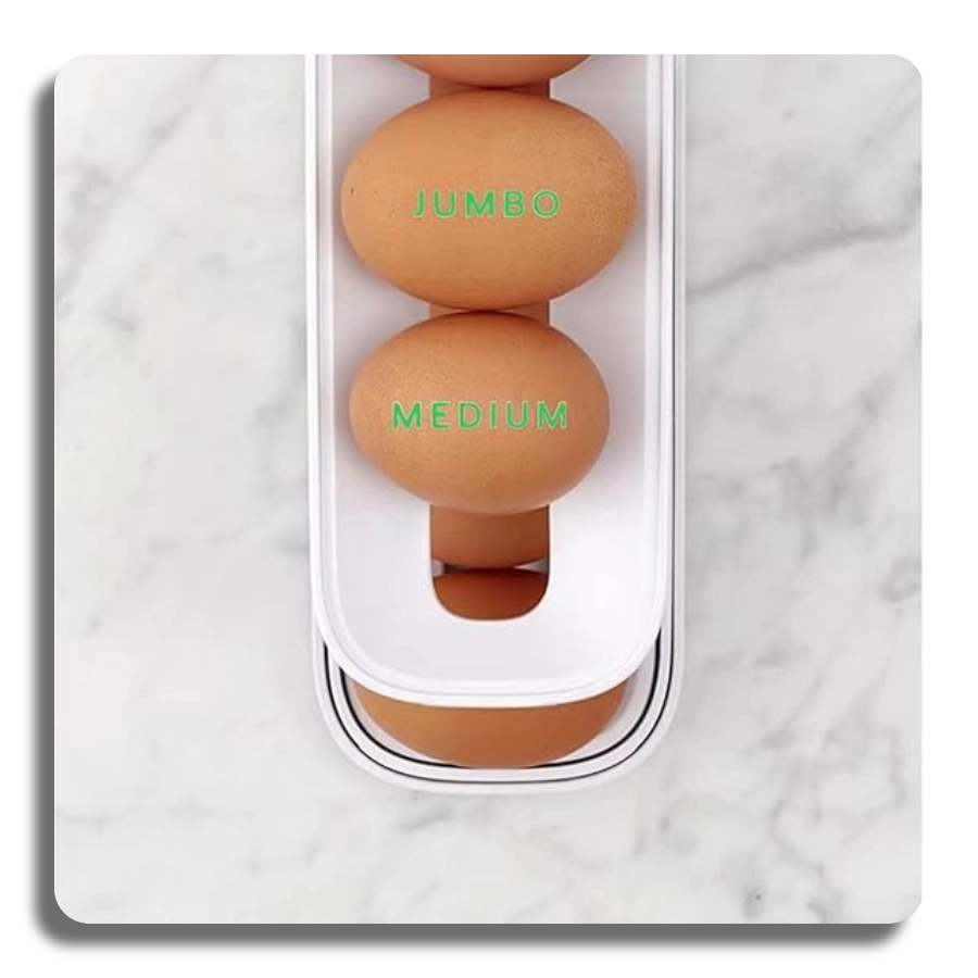 Close-up view of the rolling egg rack showing its compatibility with different egg sizes, including Medium and Jumbo eggs.